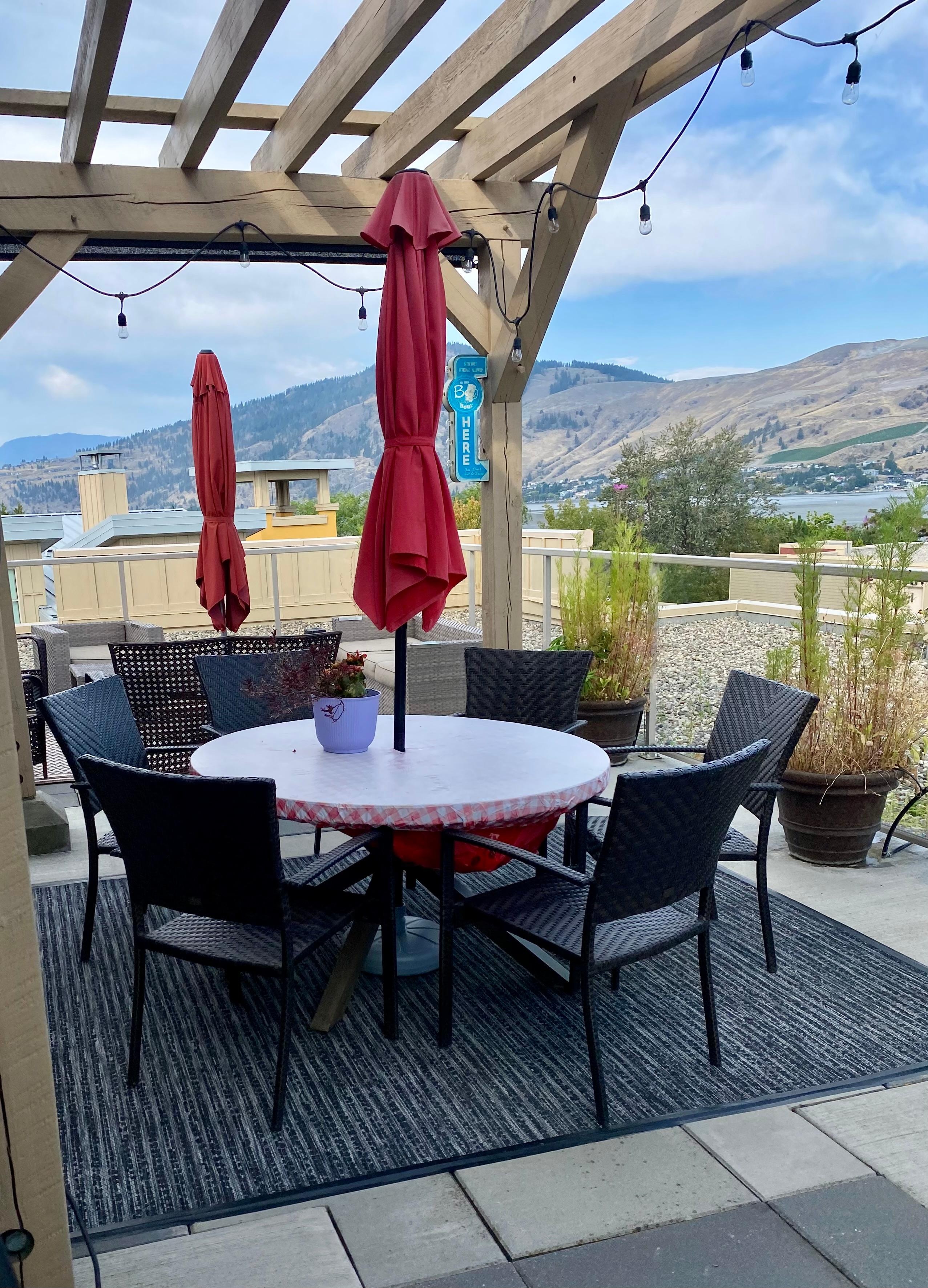 Rooftop patio with loungers & eating area as well as a bbq. 