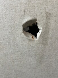 Hole in bathroom.