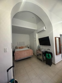 entry and to the left, the bed