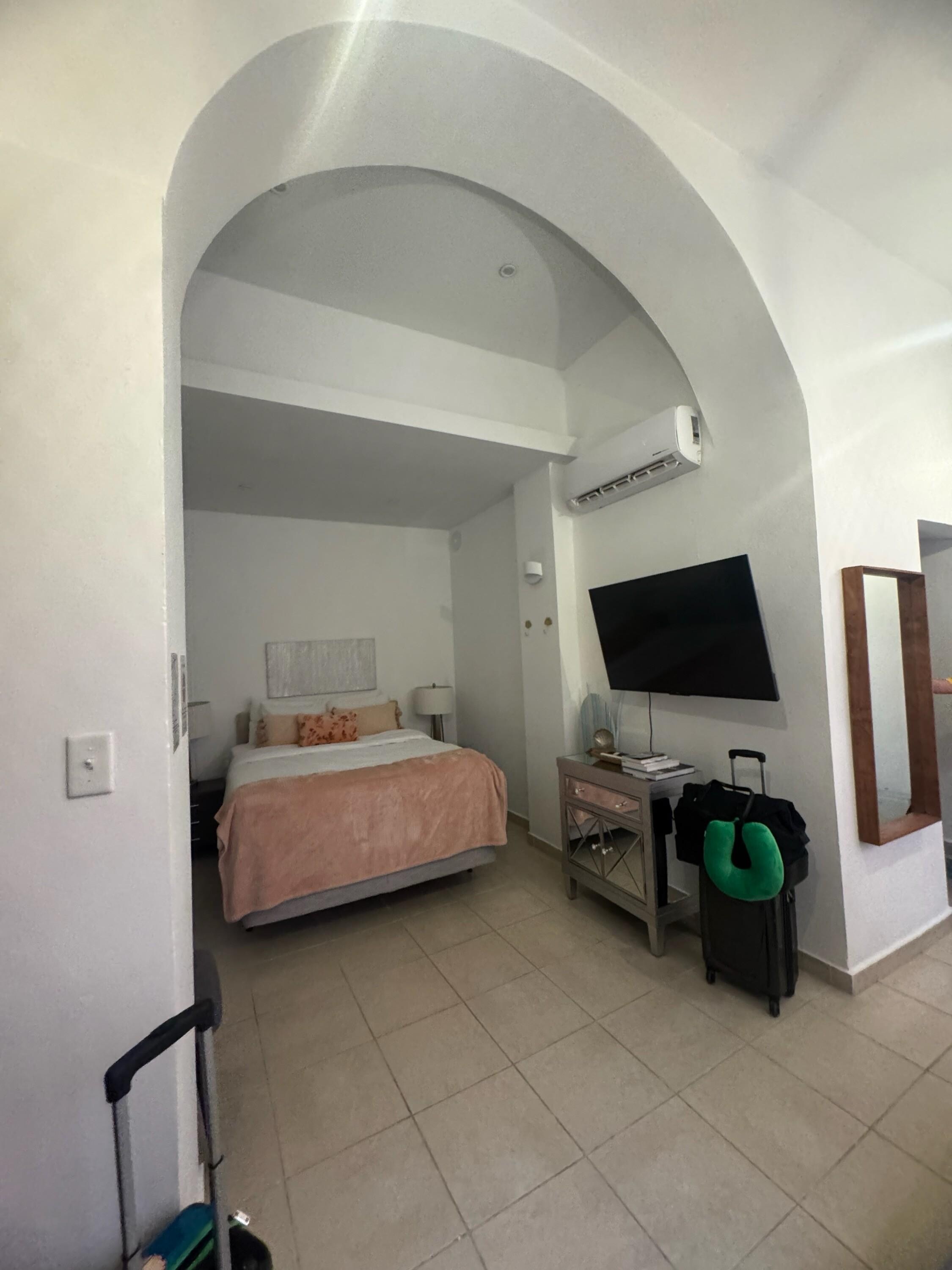 entry and to the left, the bed
