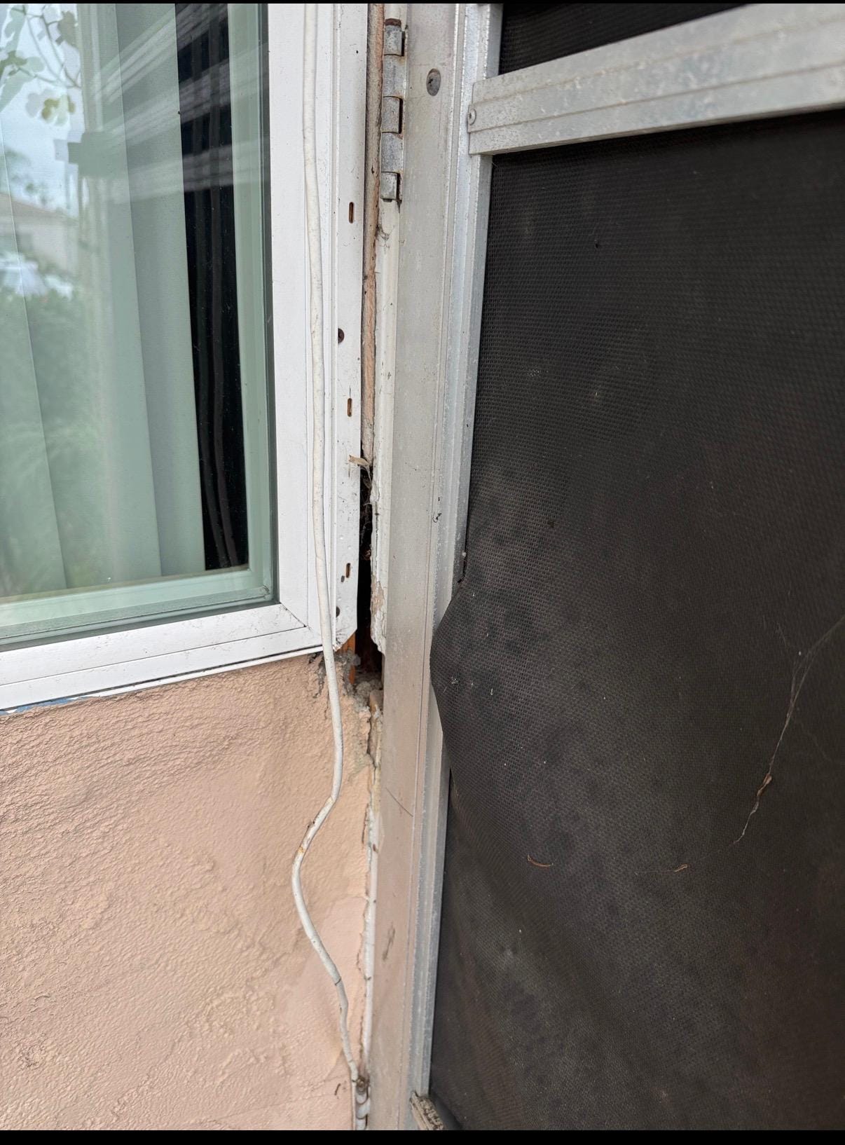 Hole in wall by front door