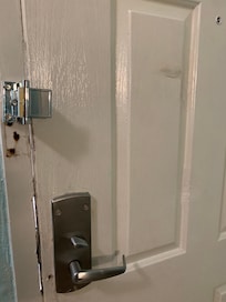 Fist dents, door jamb crack, safety latch after the friendly maintenance man fixed it.