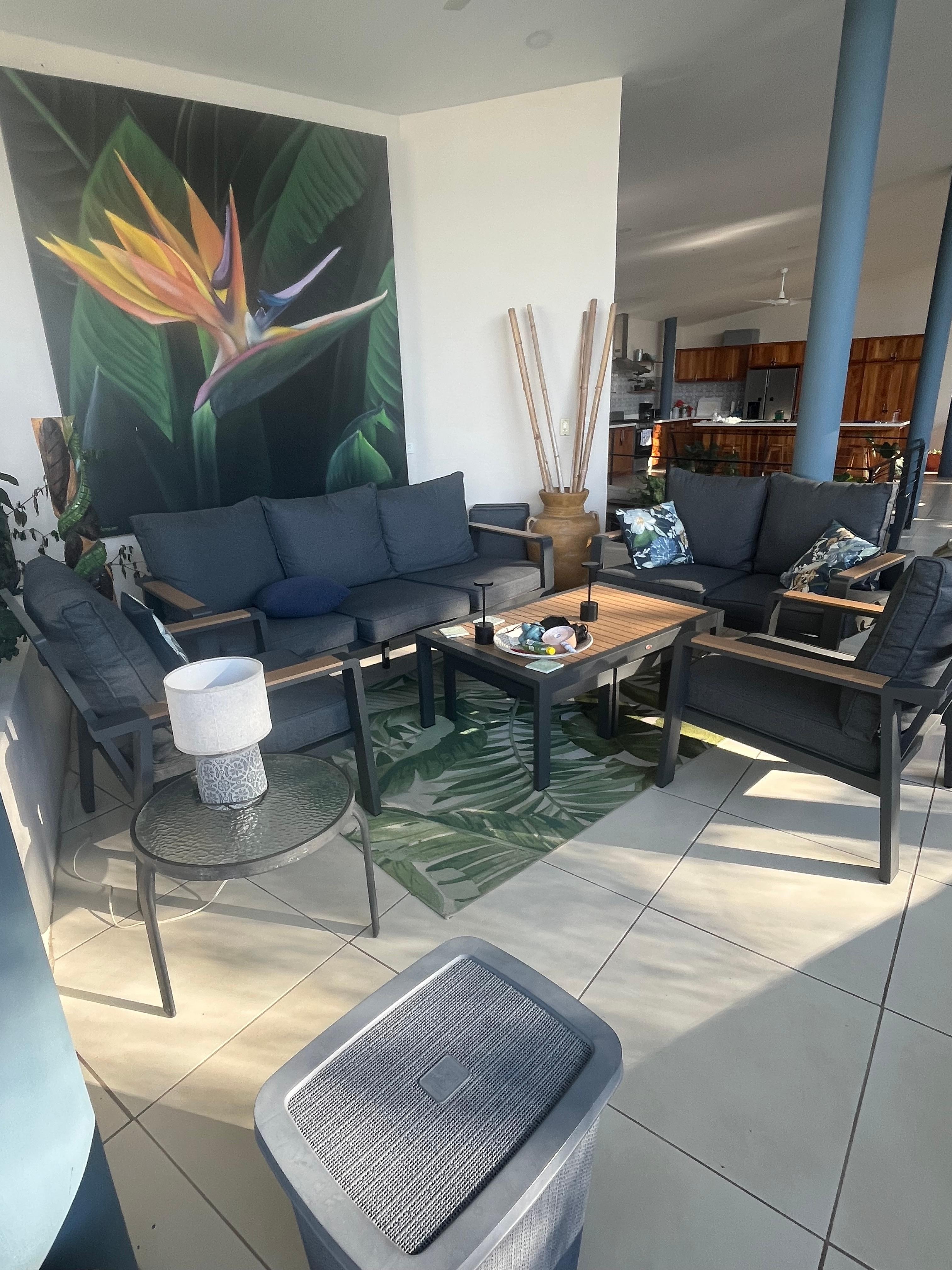 Lovely upper floor gathering space with views of the pool and jungle and ocean