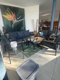 Lovely upper floor gathering space with views of the pool and jungle and ocean