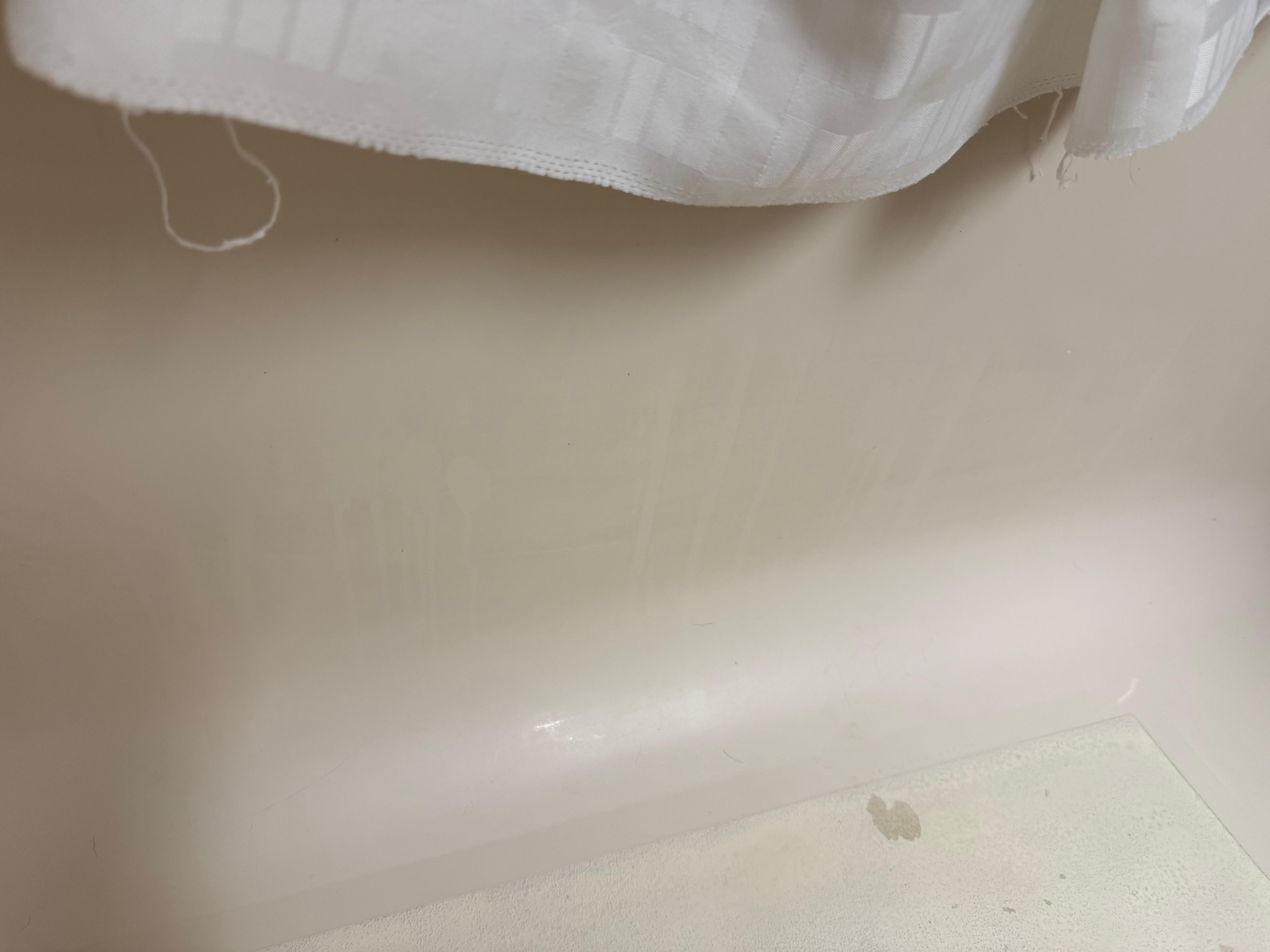 Sorry bathtub. It was not a stain, it came right off when I cleaned it