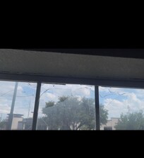 Broken window. I was able to put my hand through the glass.