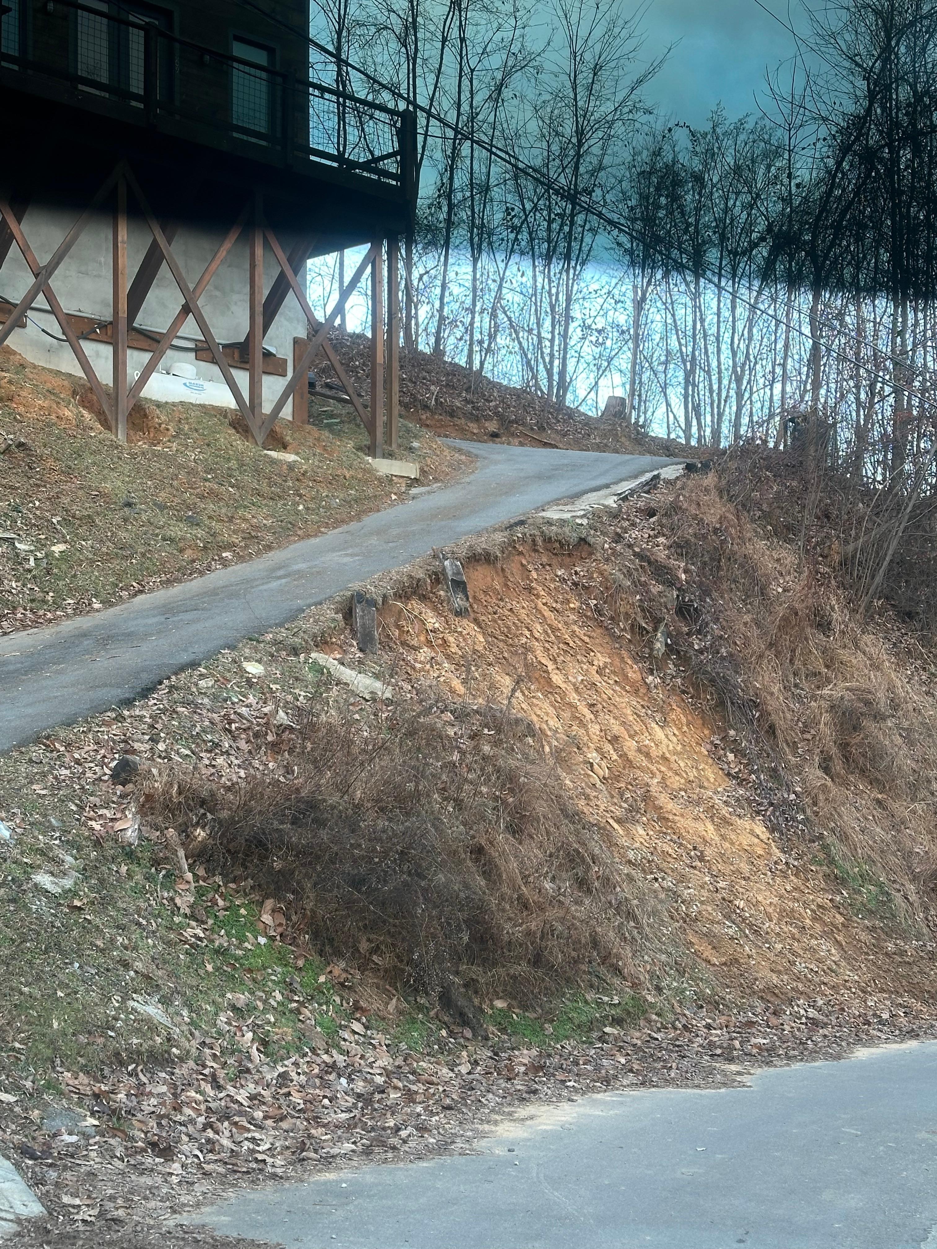 Very steep driveway which is common in this area, but retaining wall in the middle is gone and washing away in the middle of the very narrow driveway. Very sketchy! 