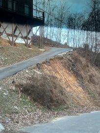 Very steep driveway which is common in this area, but retaining wall in the middle is gone and washing away in the middle of the very narrow driveway. Very sketchy!