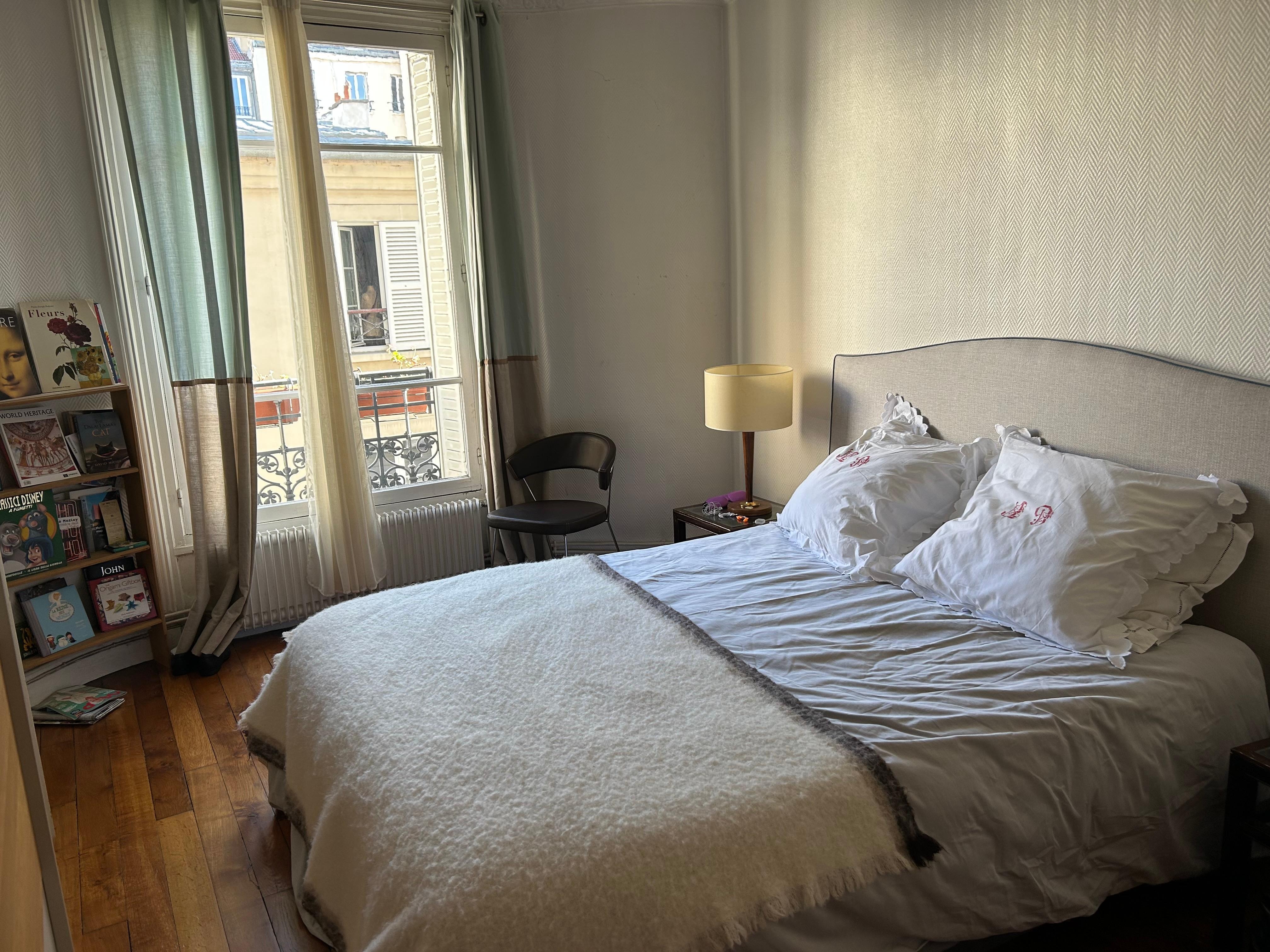 Bedroom has view of Tour Eiffel