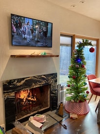 Living room with fireplace and our Grinch Christmas tree 🎄