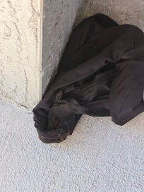 We booked 4 nights and decided to stay somewhere else one night. This was on door stoop when we came back. Either worn panties or a dirty doo rag, not sure which.