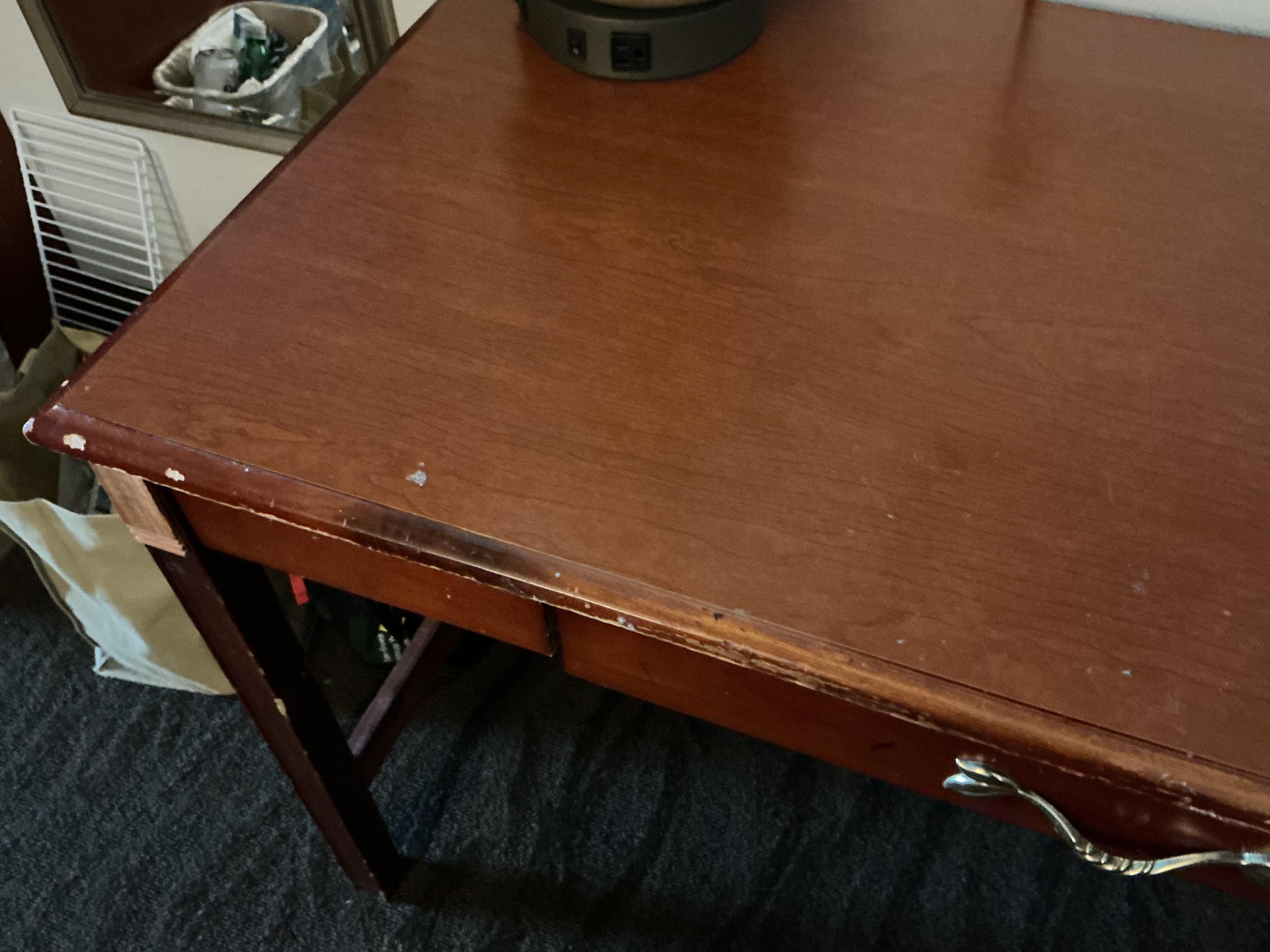 Chipped and scratched desk.