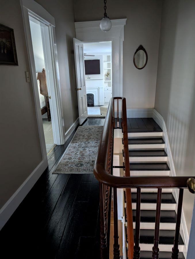 Upstairs. There are 2 sets of stairways.