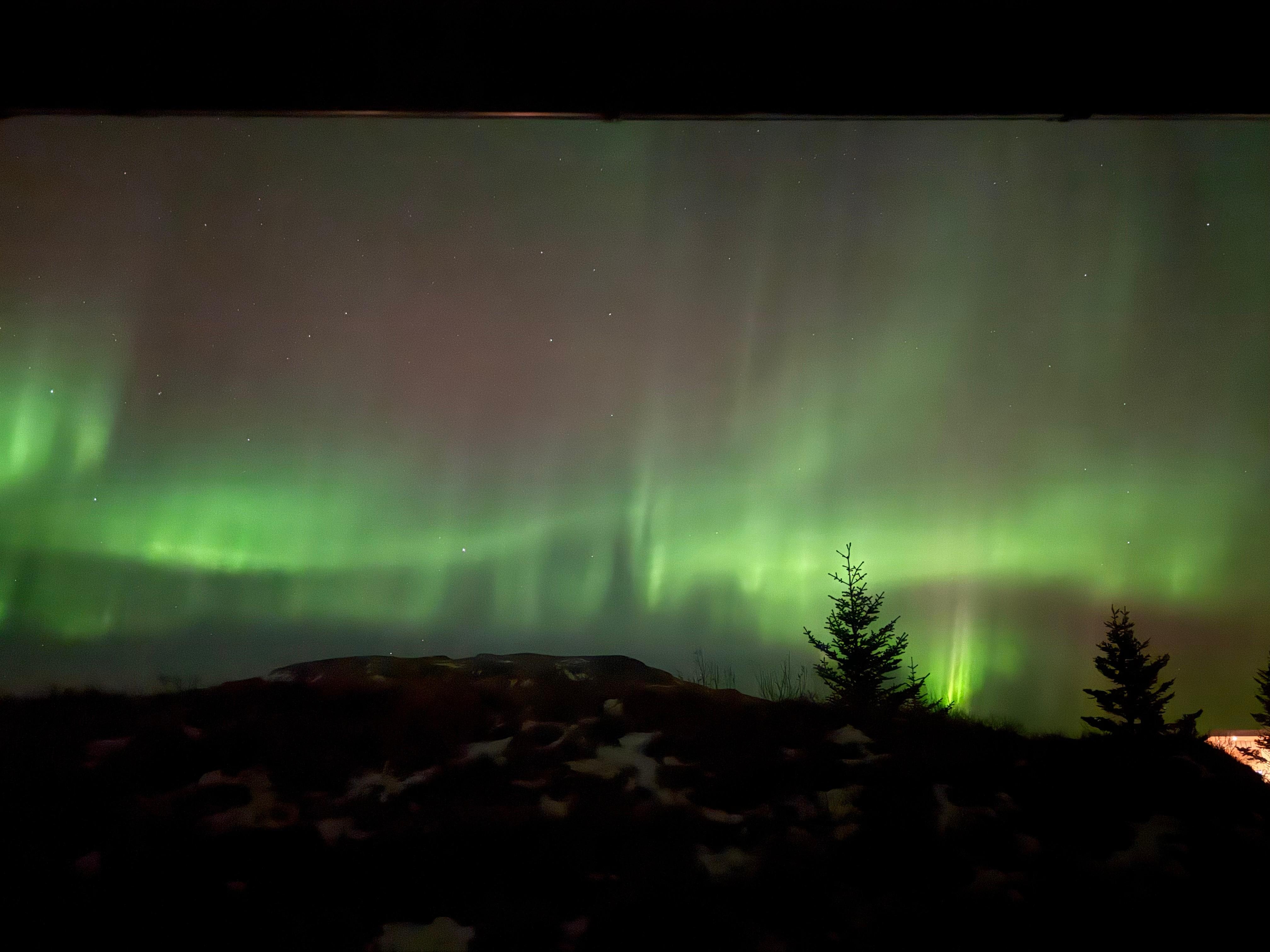 Northern lights visible right outside our door. 