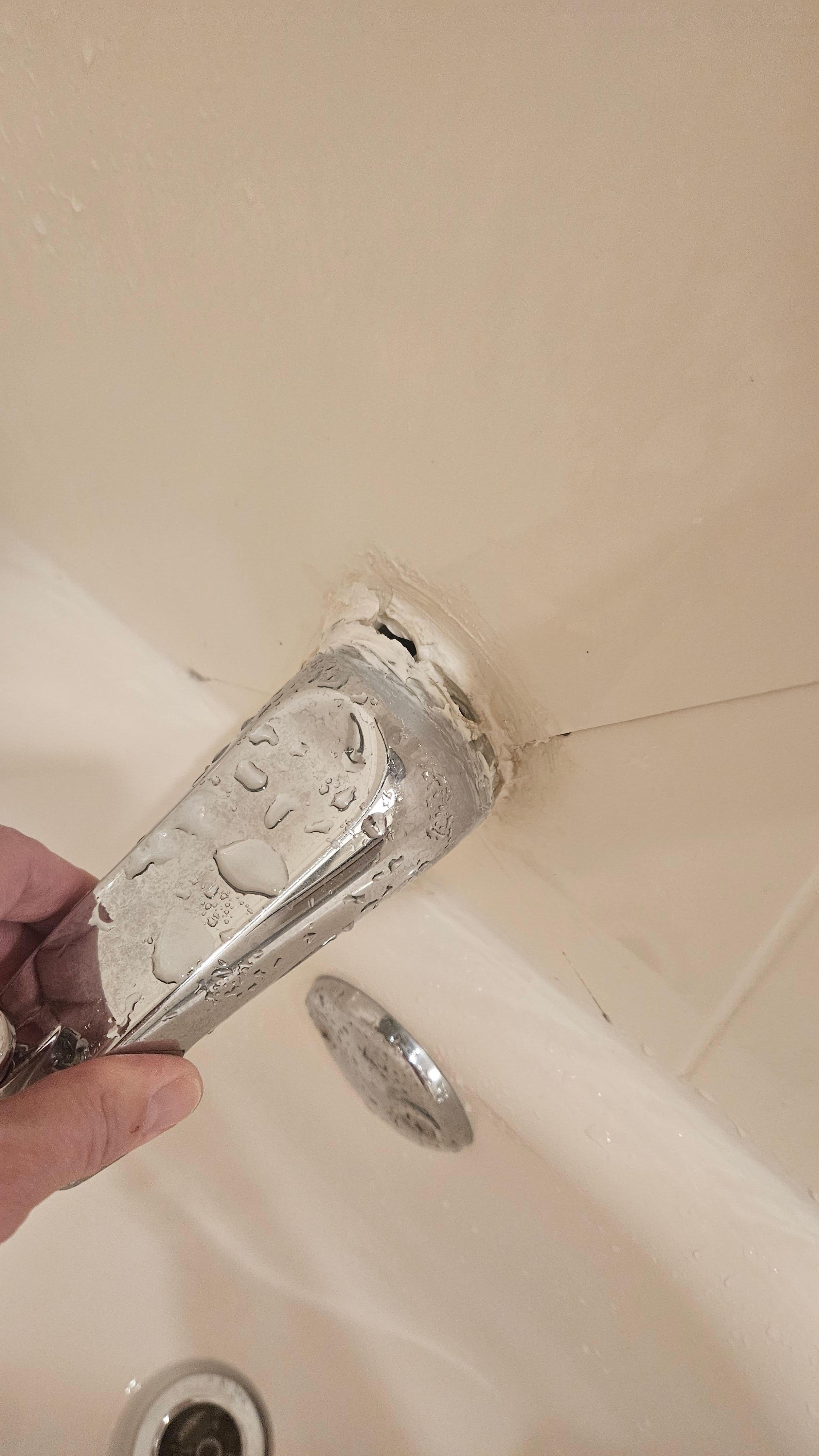 Bathtub spigot easily pulls away from wall.
