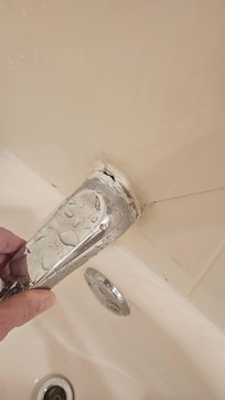 Bathtub spigot easily pulls away from wall.