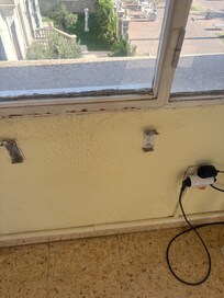 Side window & wall plus where tv which never worked & fridge were plugged into