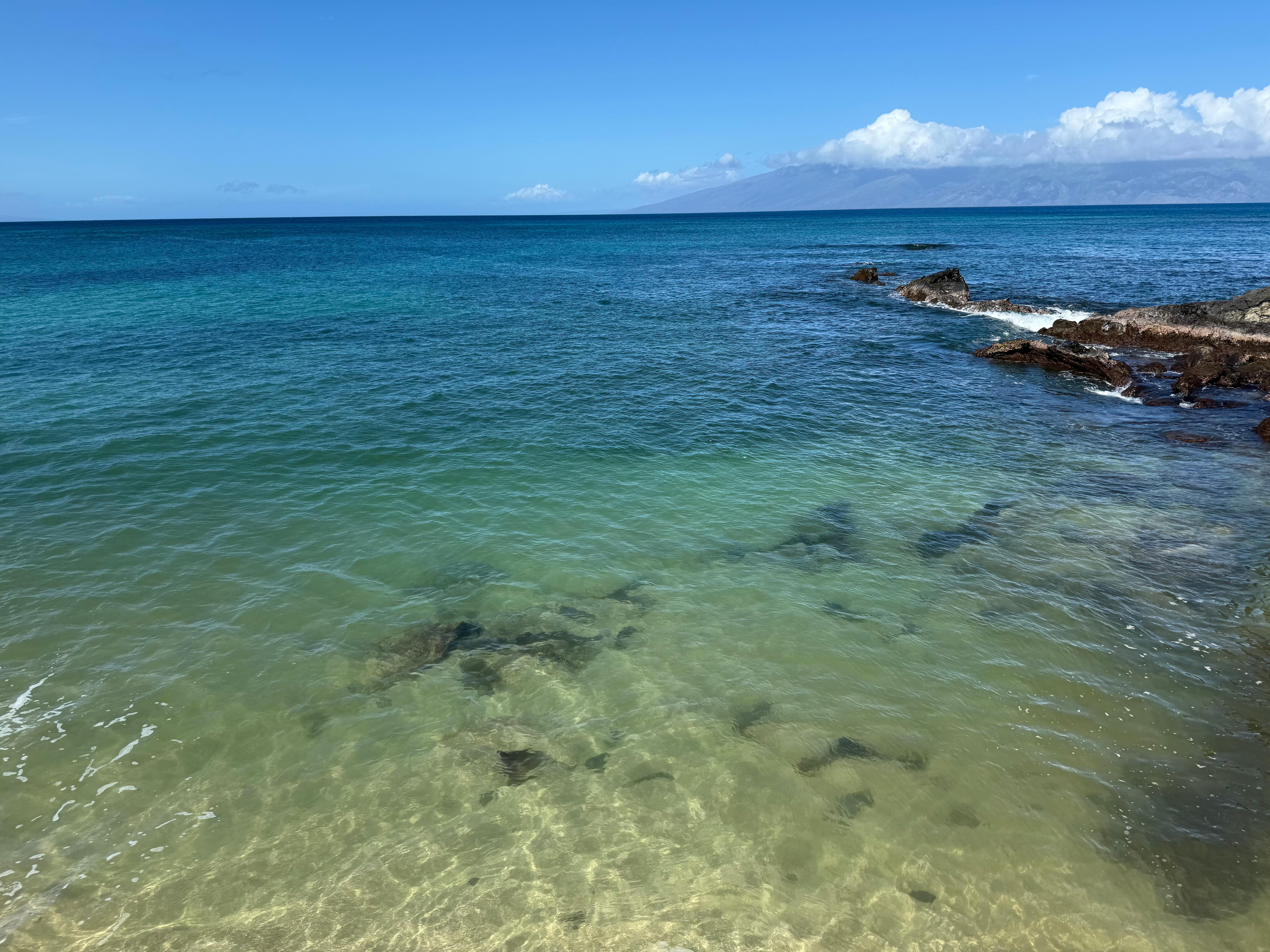 A good view of the sand and rocks in the swimming area