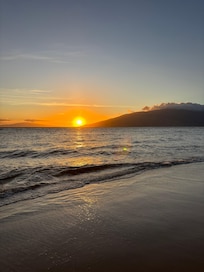 Beach sunset by house.
