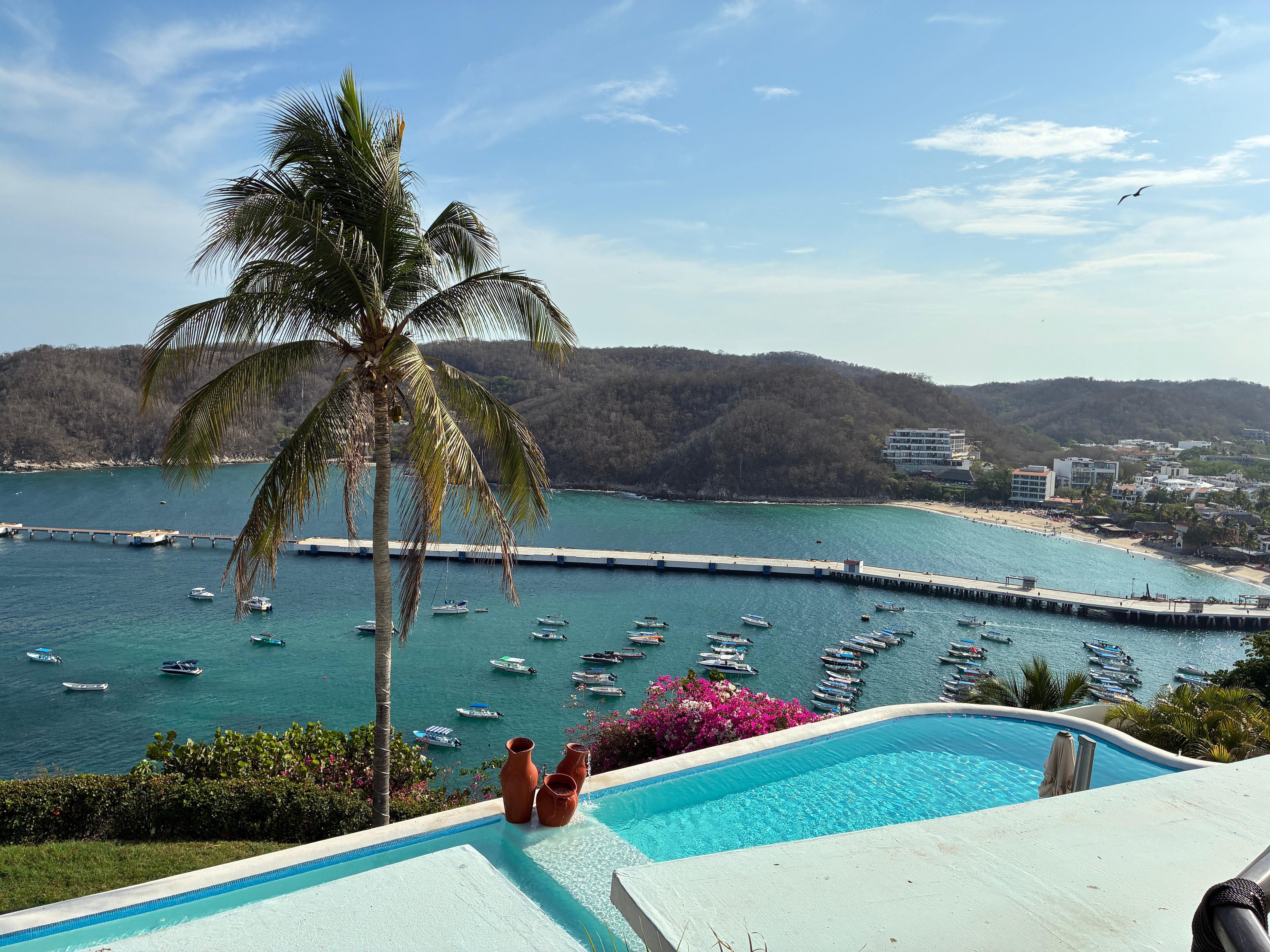 Bay and pool views from deck/balcony.