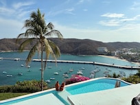 Bay and pool views from deck/balcony.