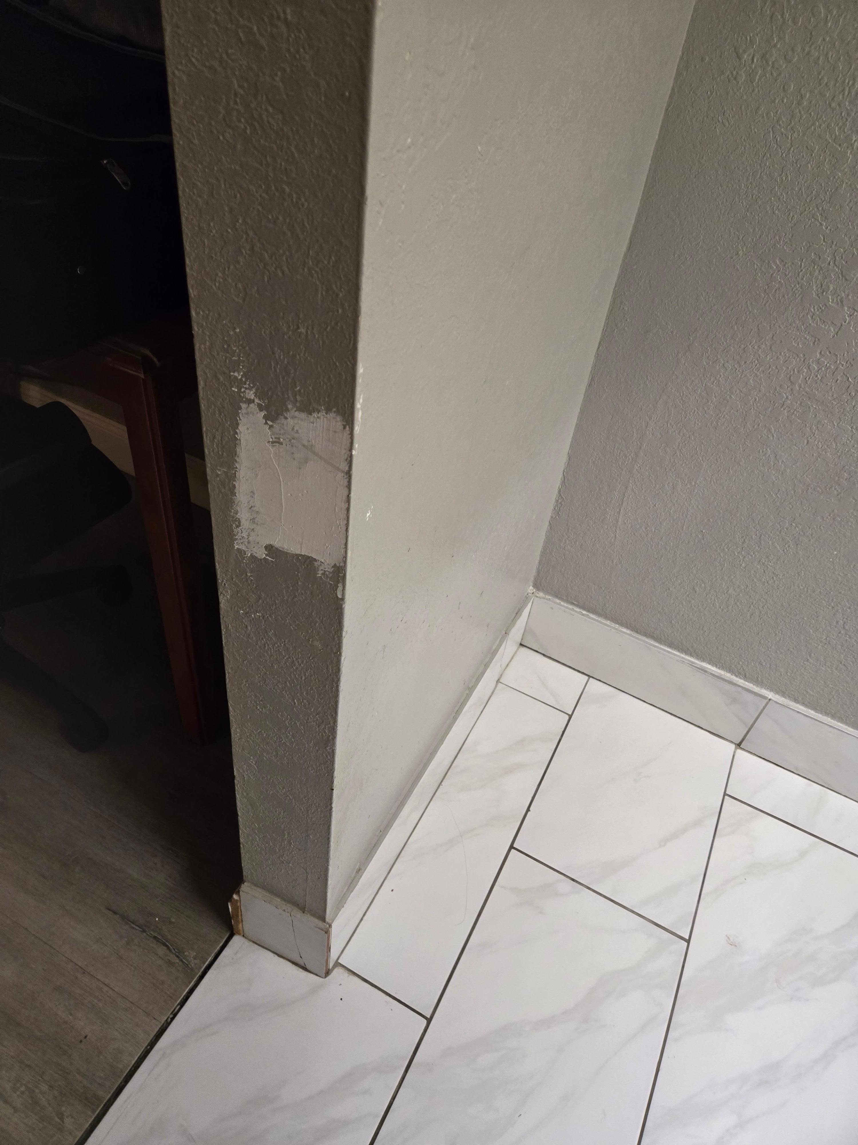 The walls had holes and there was one patch by the bathroom, but needed to be sanded before painting.