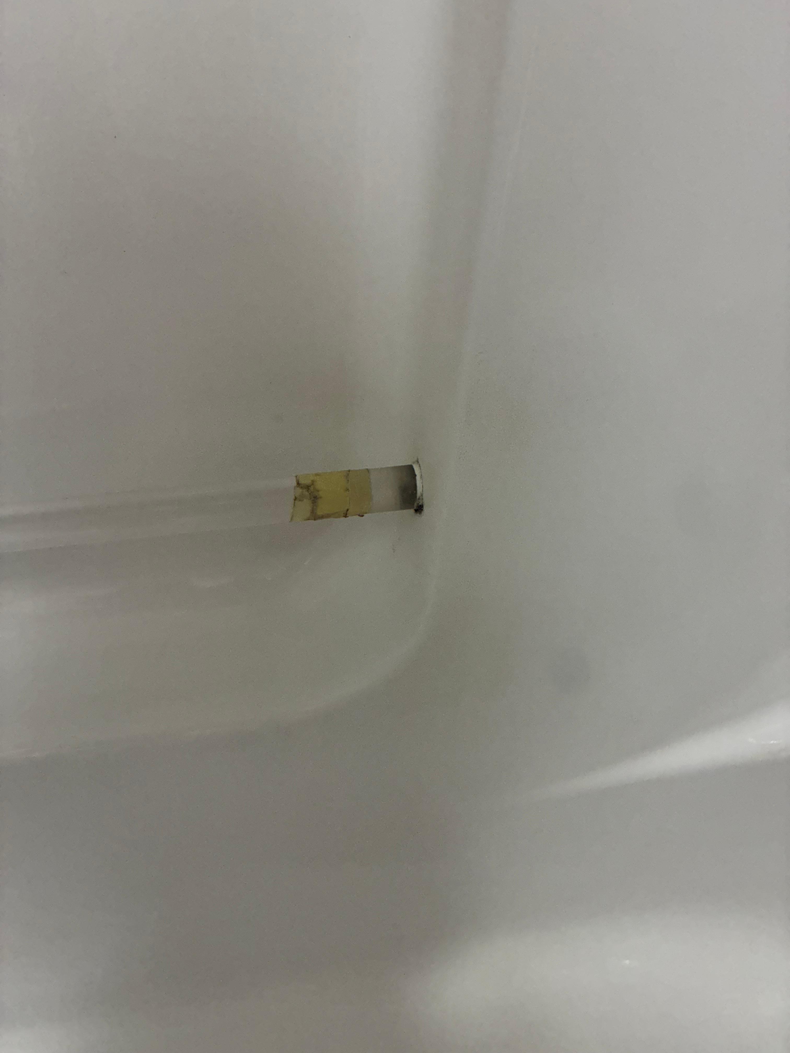Tub handle broken and repaired with tape. 