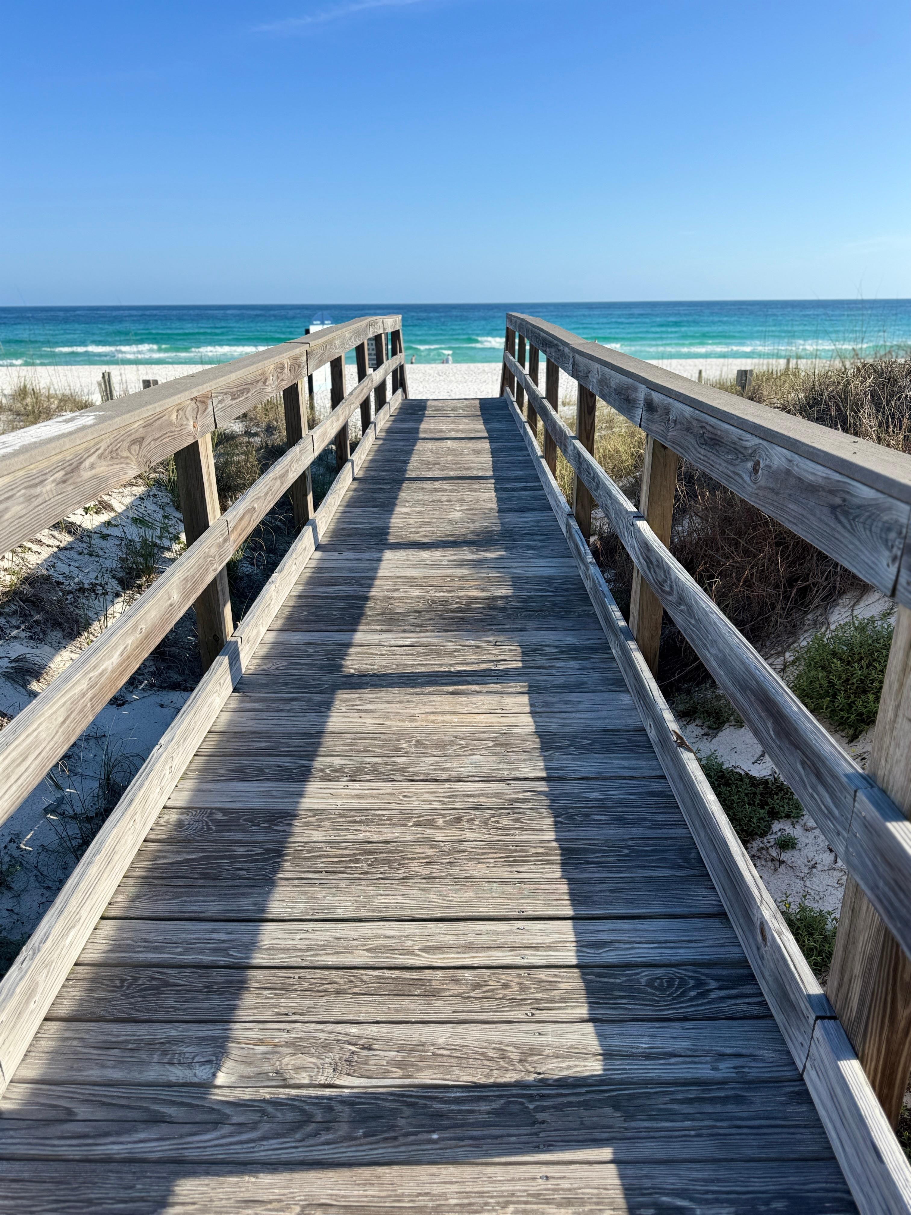 Very short boardwalk from backyard directly to beach