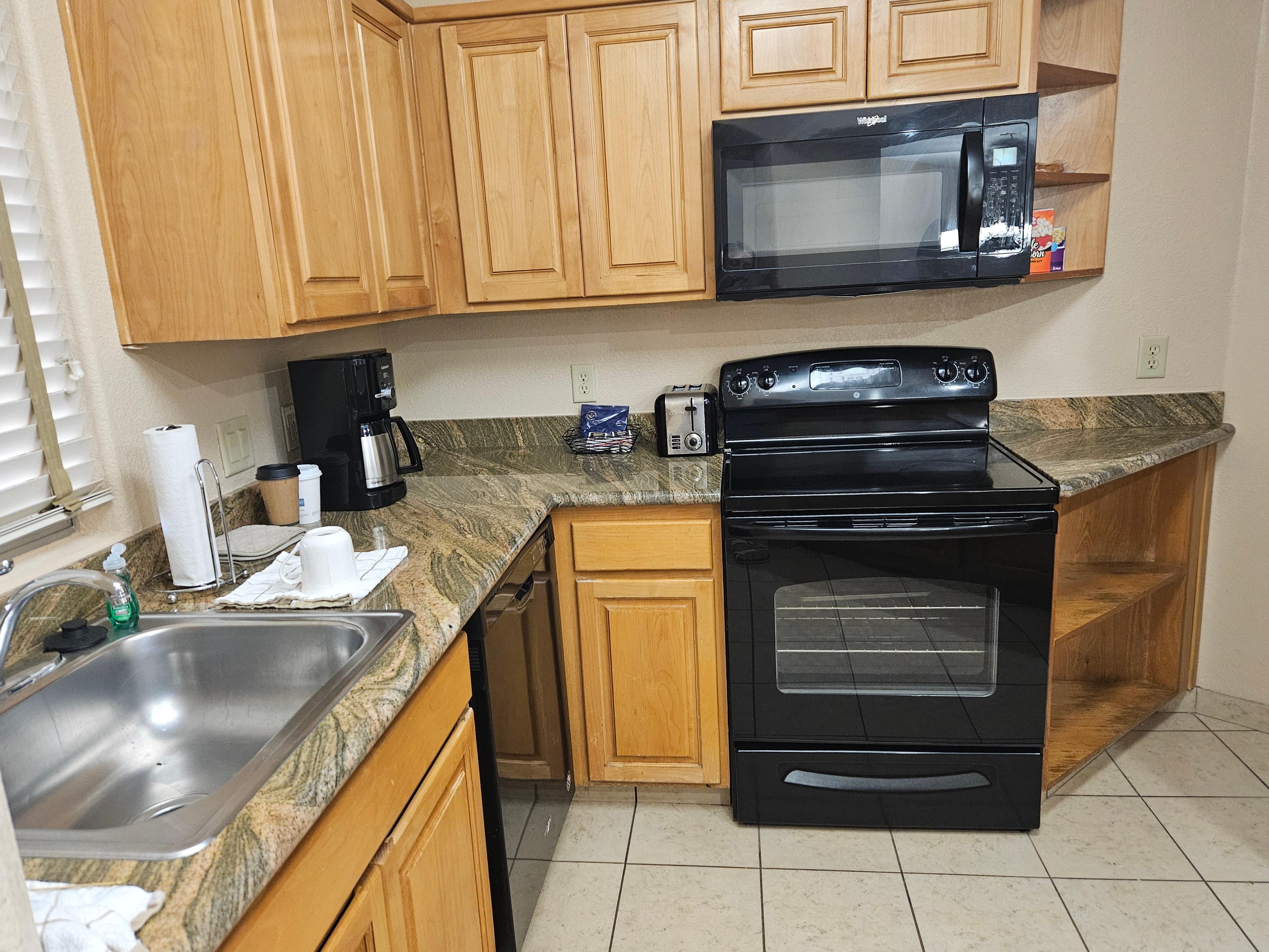 Full size kitchen equipped with utensils, plates, cutlery, pot and pans. (Even a corkscrew!)