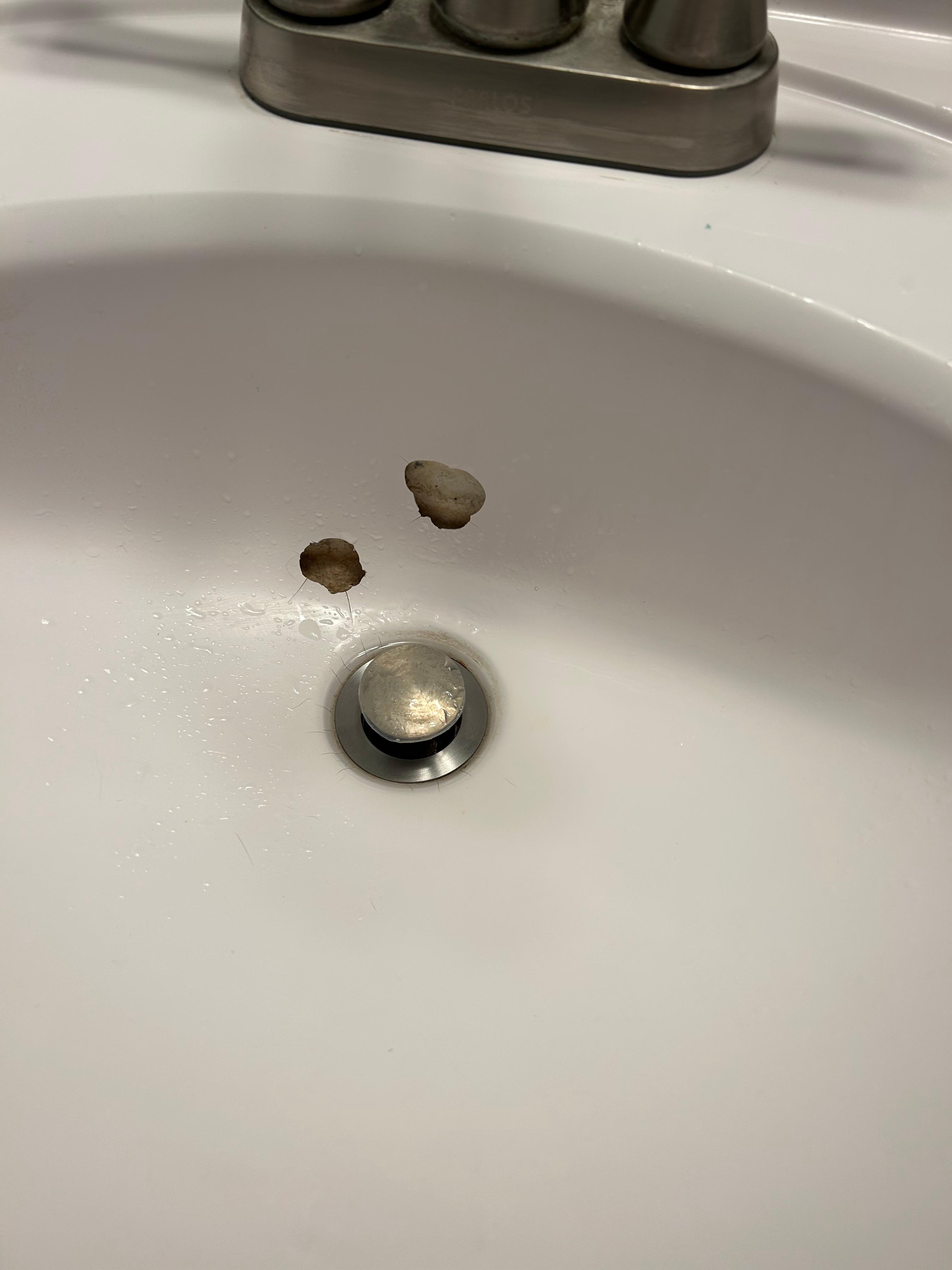 Holes in bathroom sink.