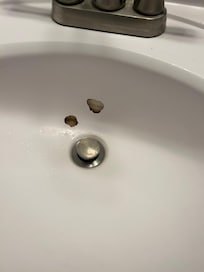 Holes in bathroom sink.