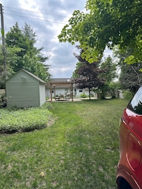 Cute pergola and grill area.