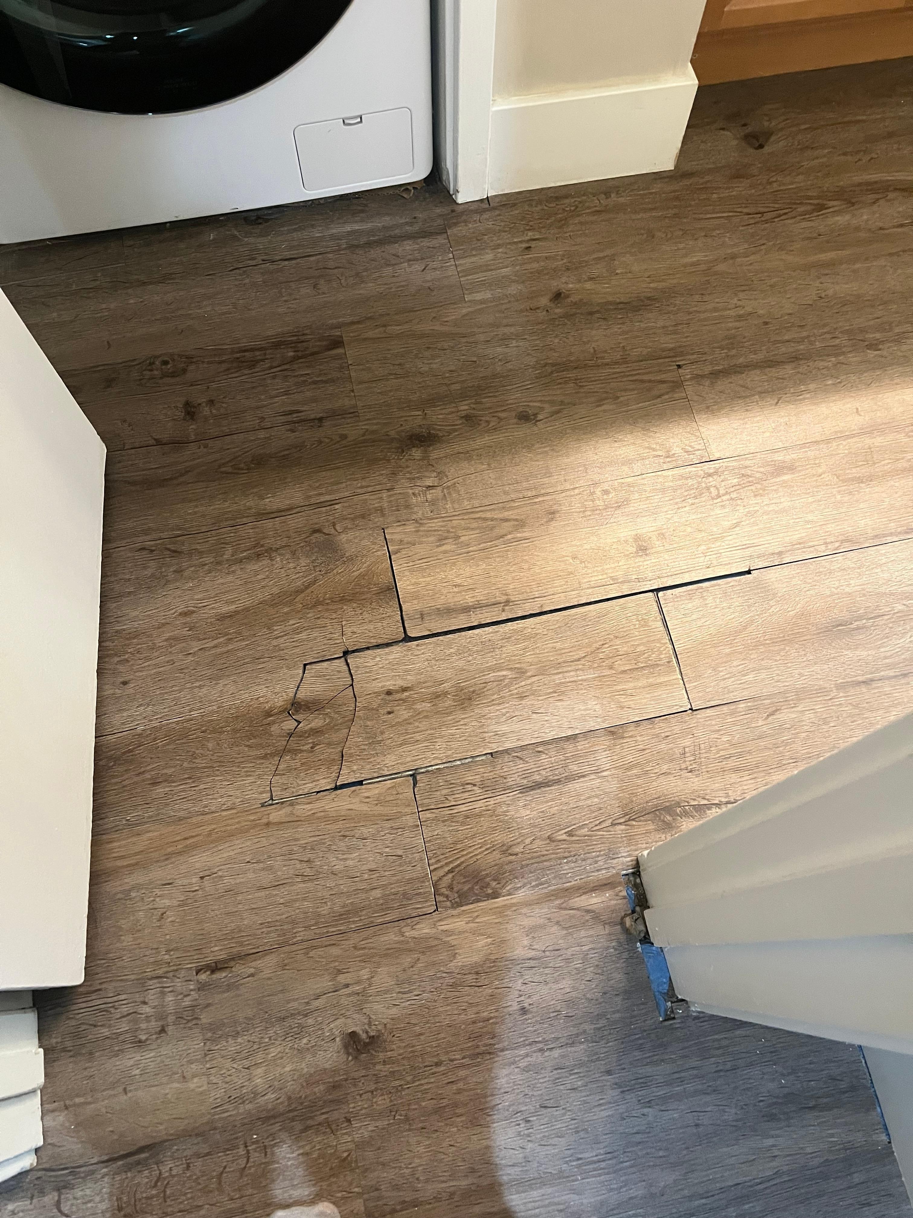 Broken flooring in bathroom