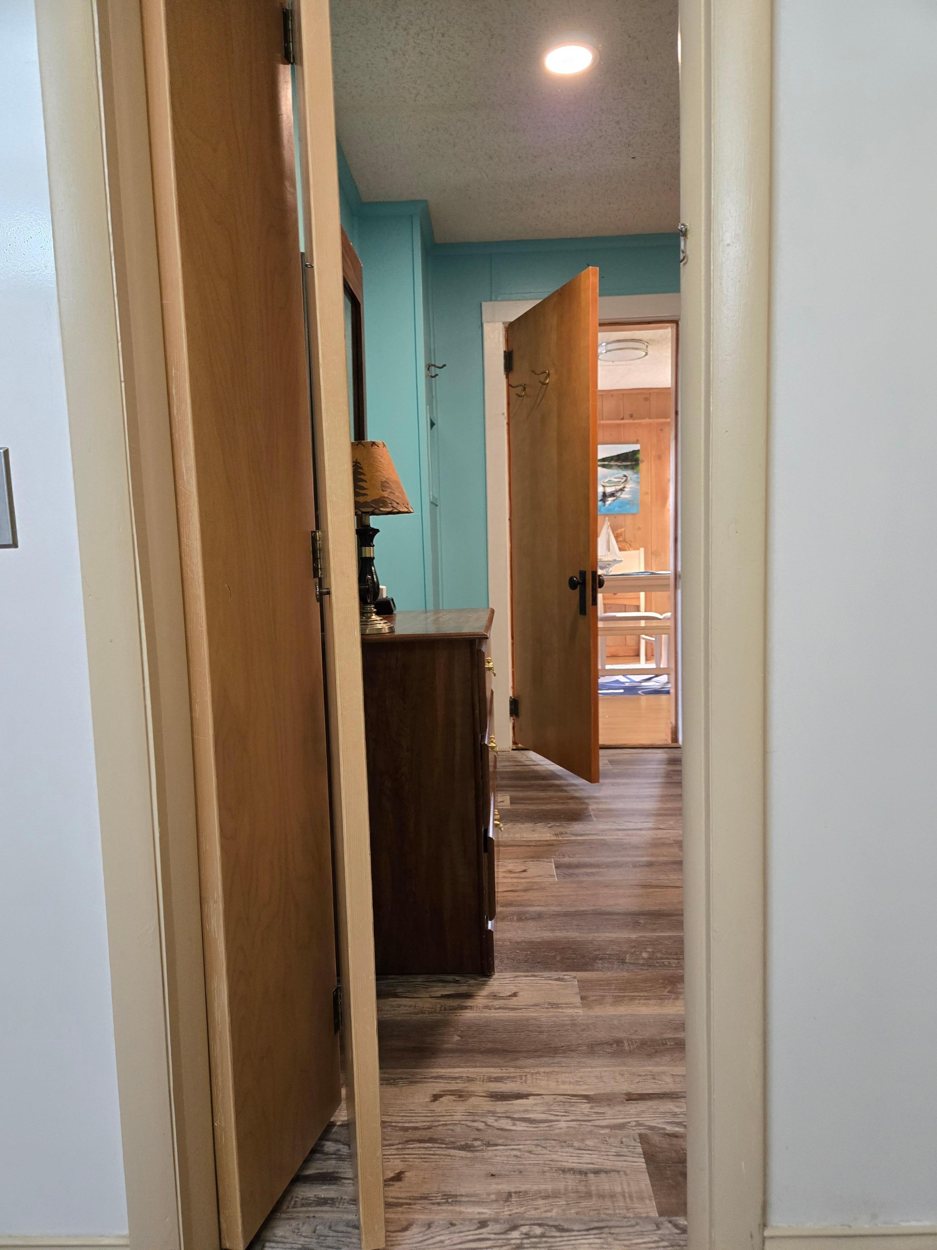 Entrance to bathroom from 2nd bedroom. Very narrow doorway with thin bifold door. Inaccessible with walker 