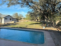 Swimming pool & behind backyard