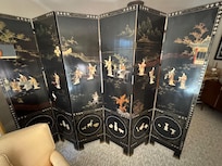 Beautiful screen separating the space into living and bedroom areas