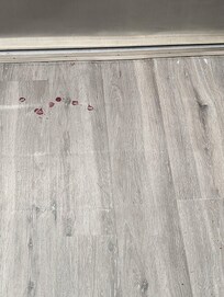 Floor heading to exit door after getting off the elevator to the exit door