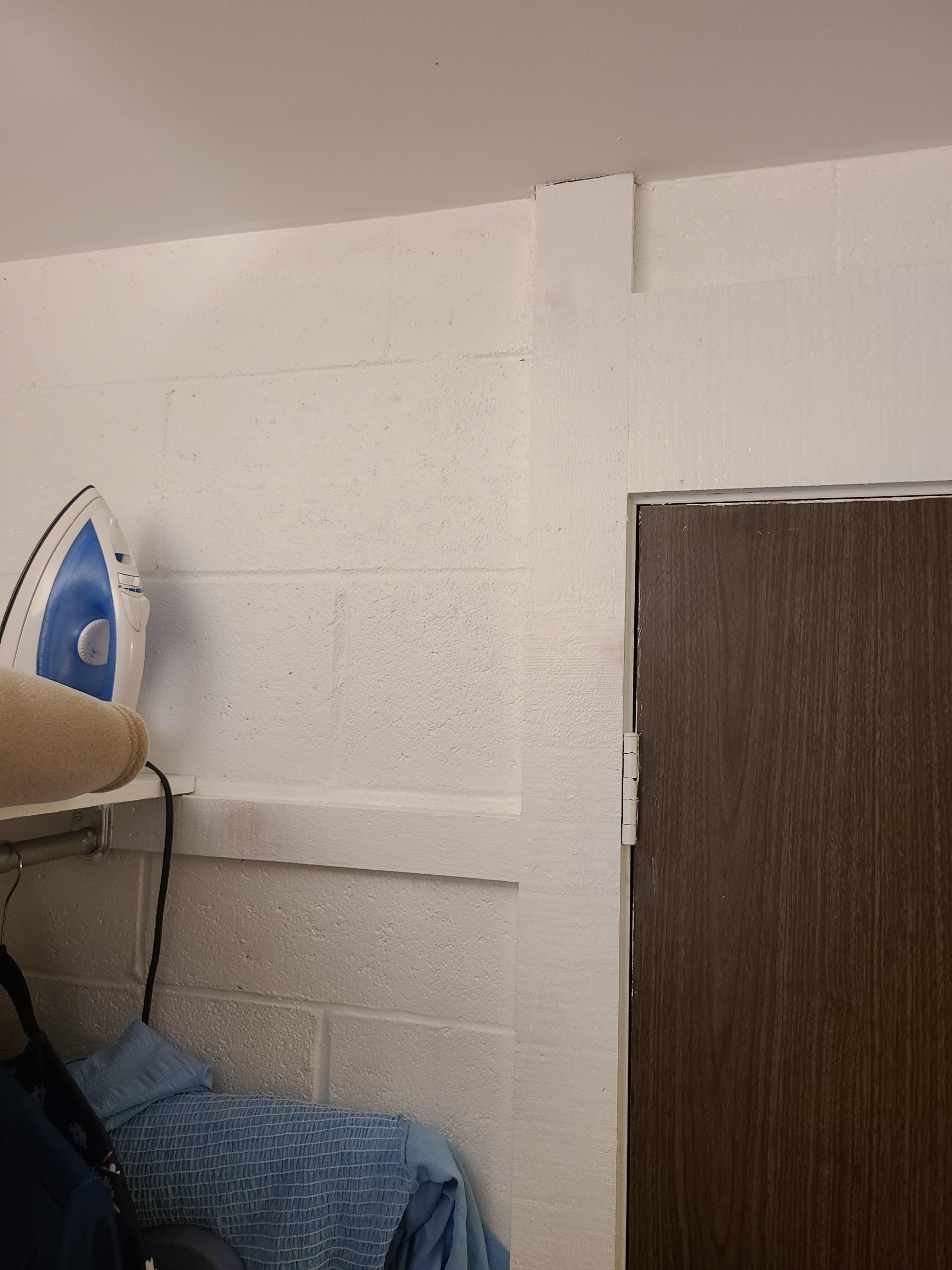 Concrete block walls not covered except with paint