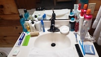 Bathroom clutter. Need small shelving