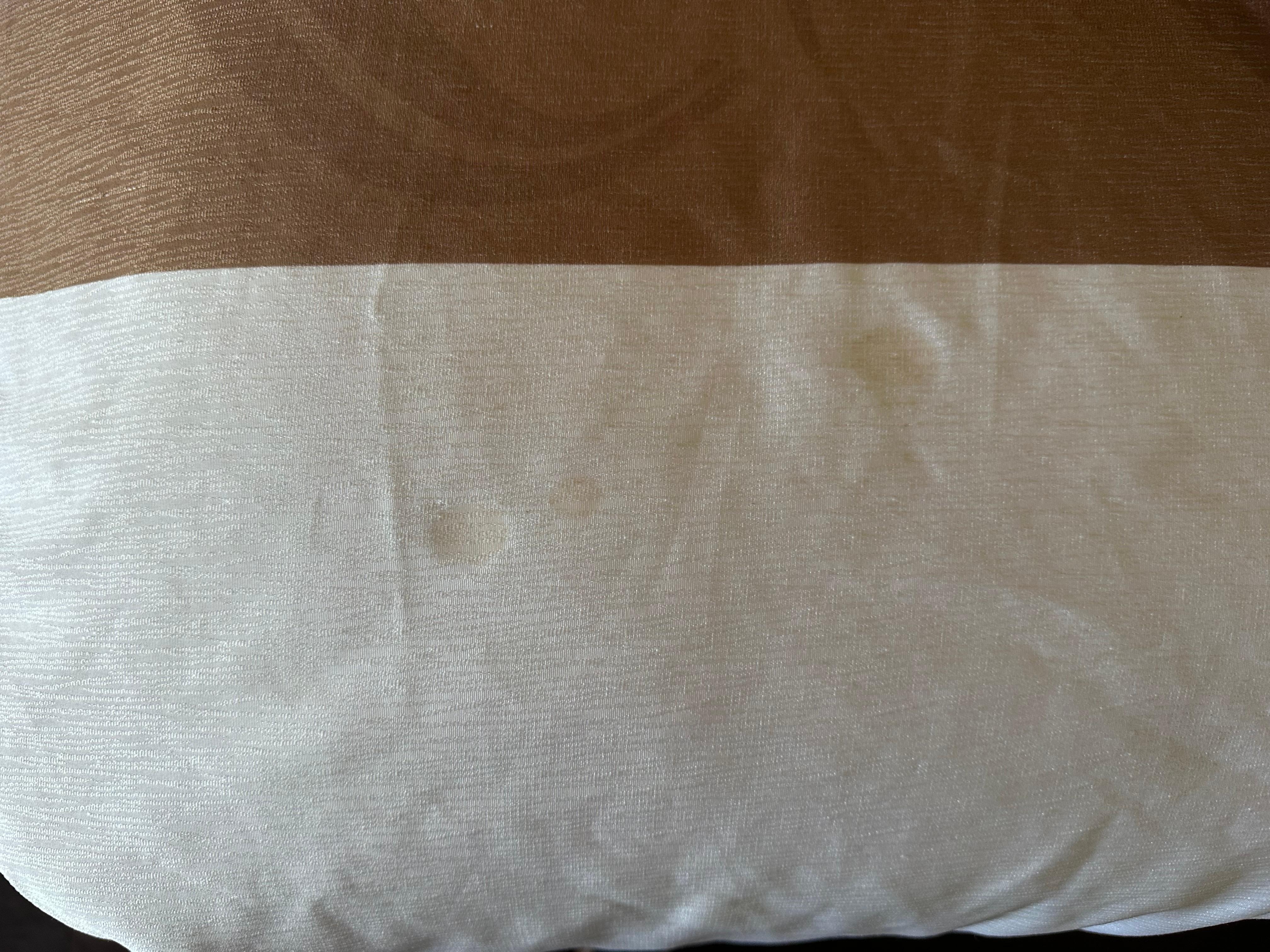 Something spilt on bedspread 