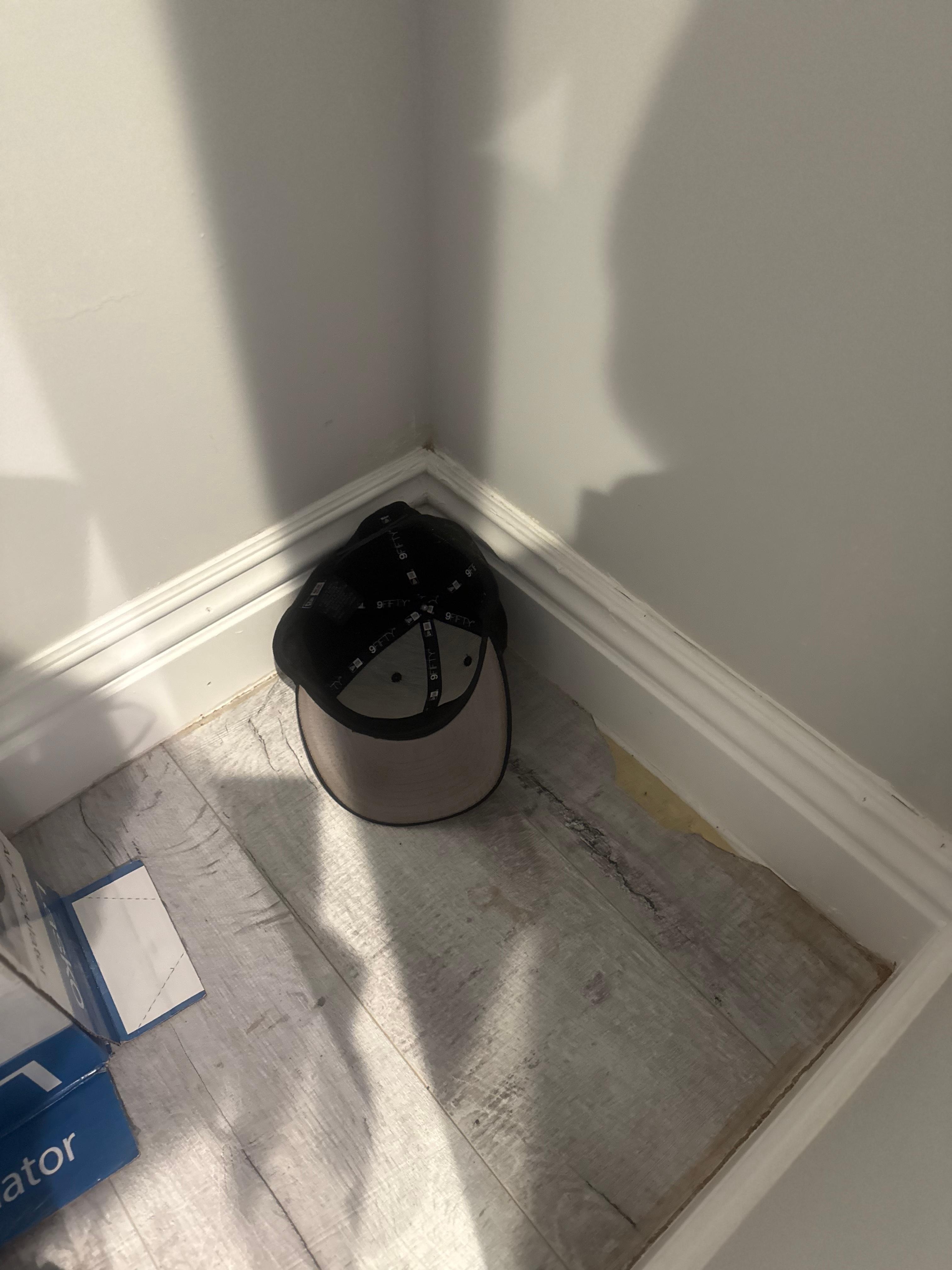 Cap on floor of closet. 