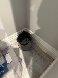 Cap on floor of closet.