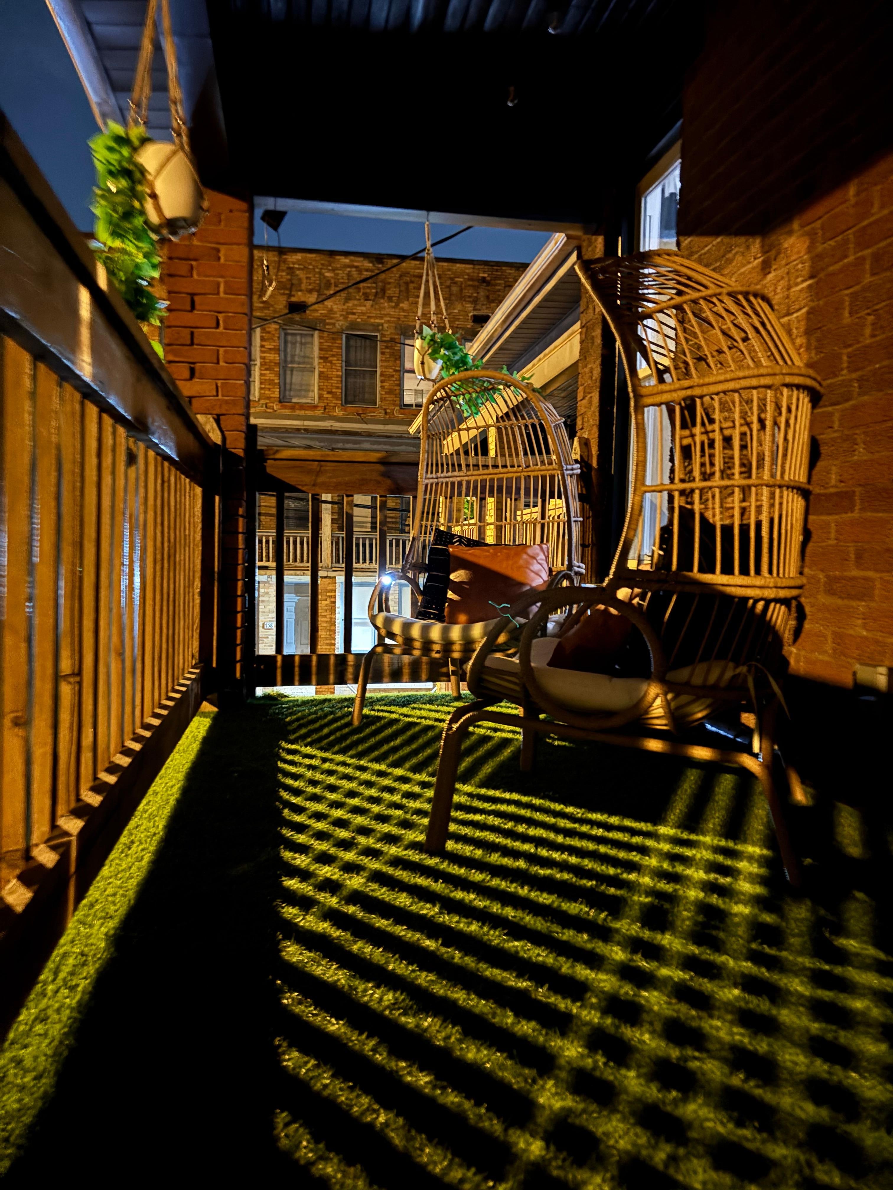 Front porch swing on top balcony is priceless for people who love to listen to the town”s heartbeat 