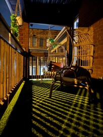 Front porch swing on top balcony is priceless for people who love to listen to the town”s heartbeat