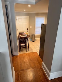 Picture taken from the main floor living room. One step down to landing, then another 2 steps into the kitchen. Stabilizers include appliance, wall corner, and chair back to make it down safely.