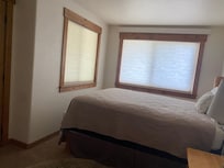 One of the queen beds downstairs