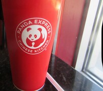 Cup with liquid on the nightstand