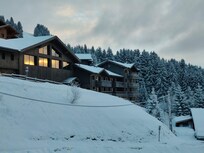 Swimming pool building and apartment is to the right.