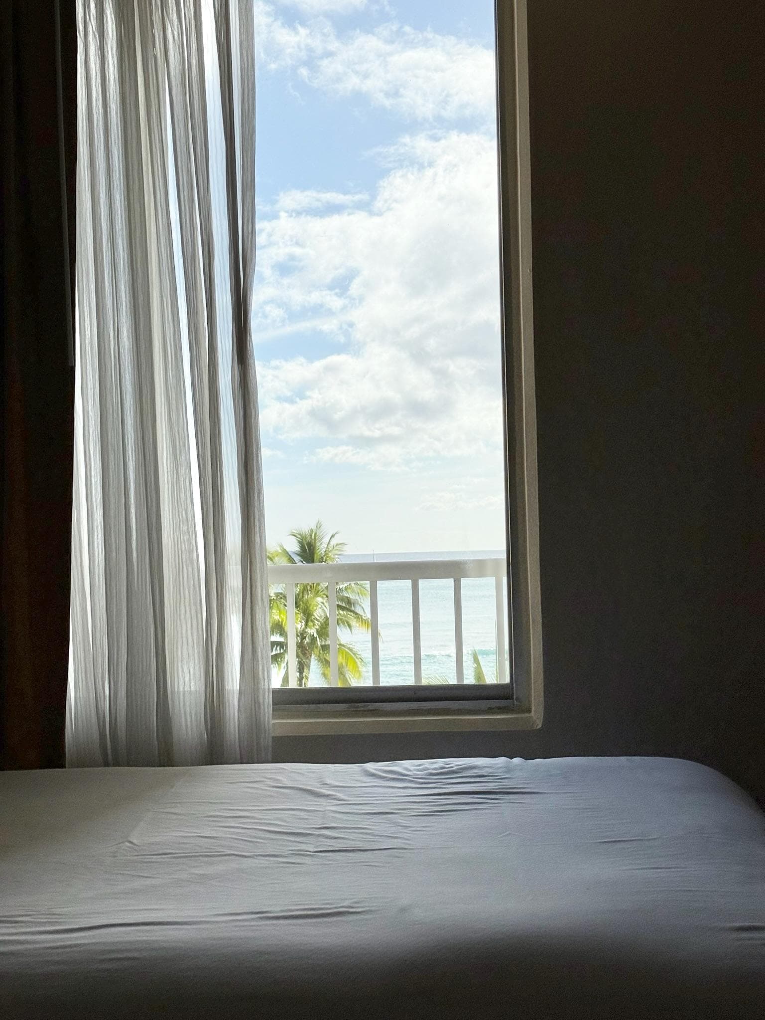 size of bed and view of beach in "partial ocean" view room