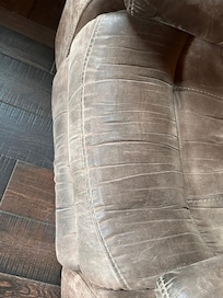 There are dark stains on anll of the upholstery.